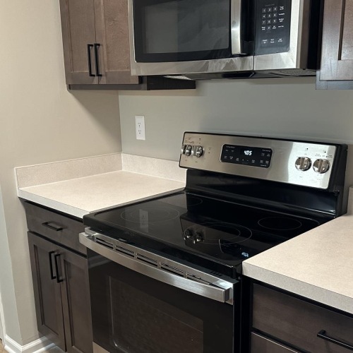 a kitchen with black appliances