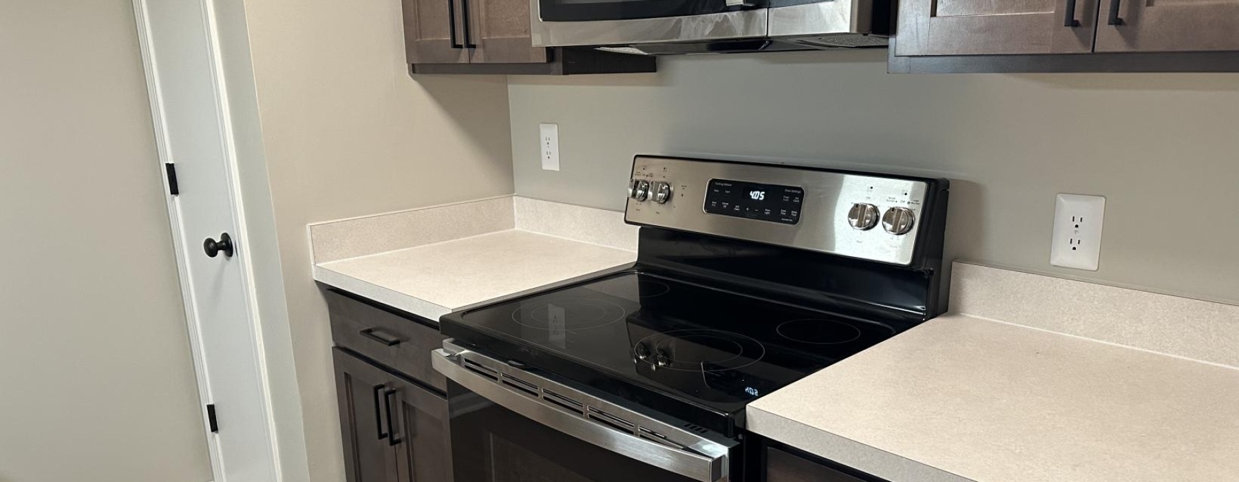 a kitchen with black appliances