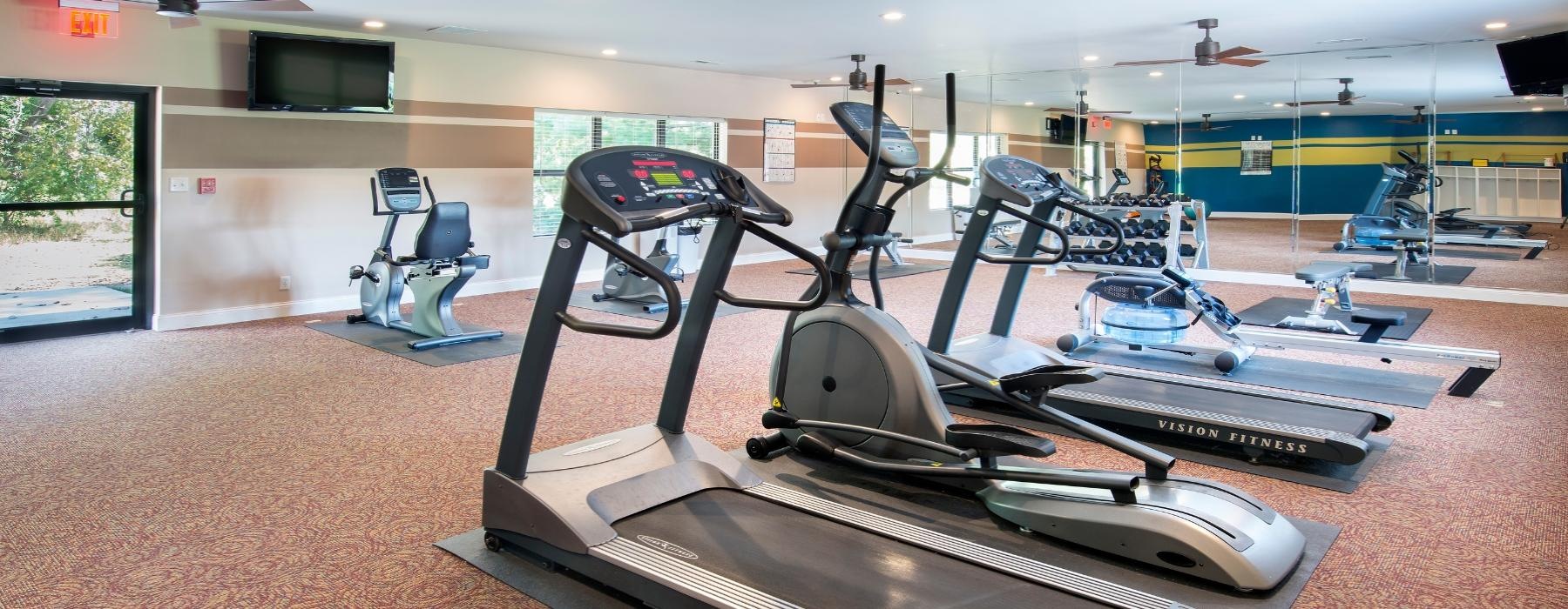 a gym with treadmills