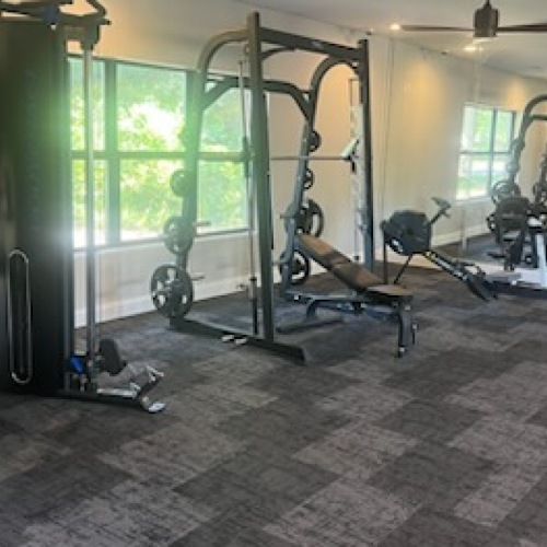 a fitness room with gym equipment 