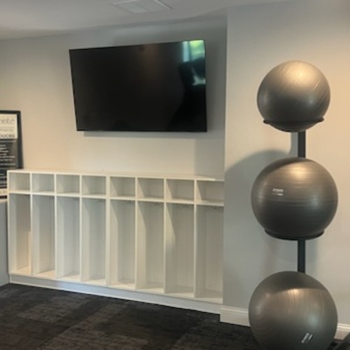 a fitness room with gym equipment 