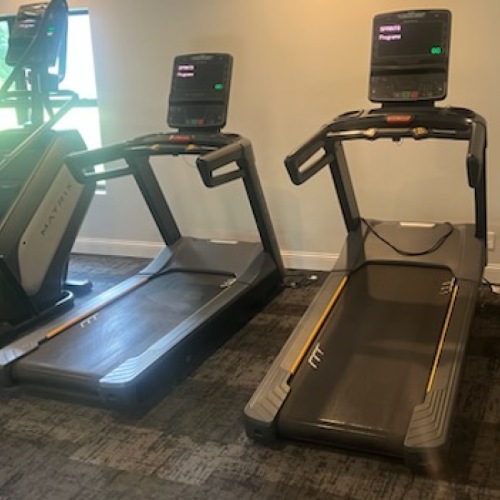 a fitness room with gym equipment 
