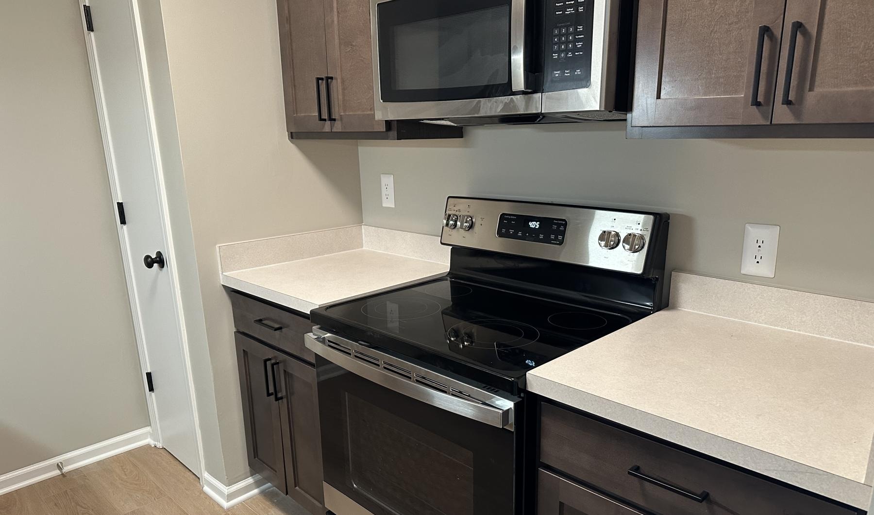 a kitchen with black appliances